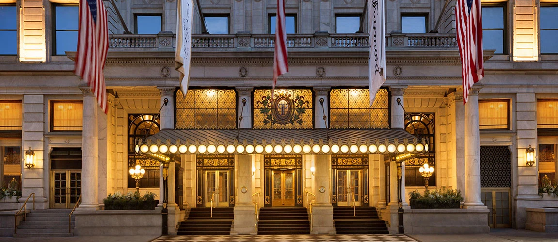 The illuminated entrance to The Plaza Hotel in New York