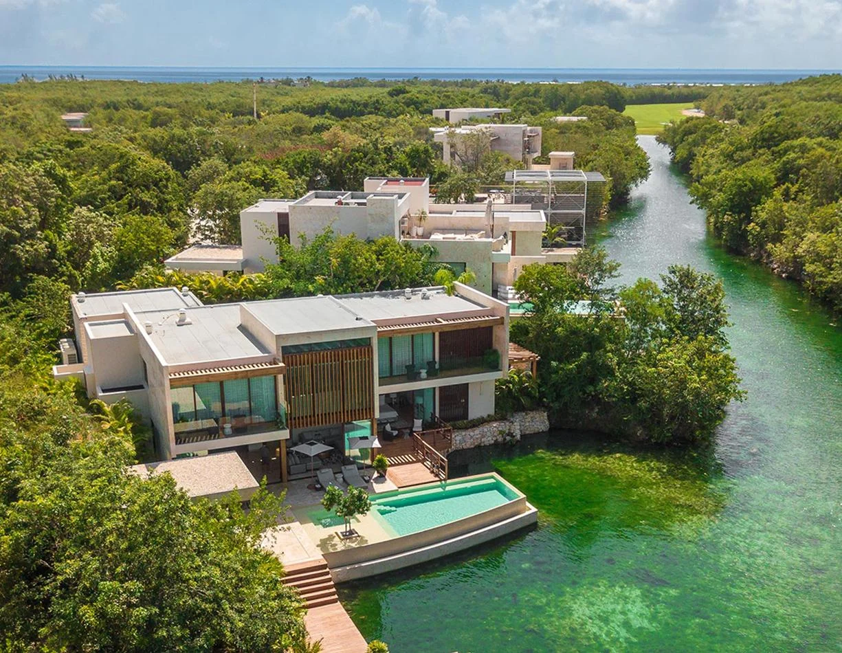 A private pool residence at Rosewood Mayakoba beside tropical waterways