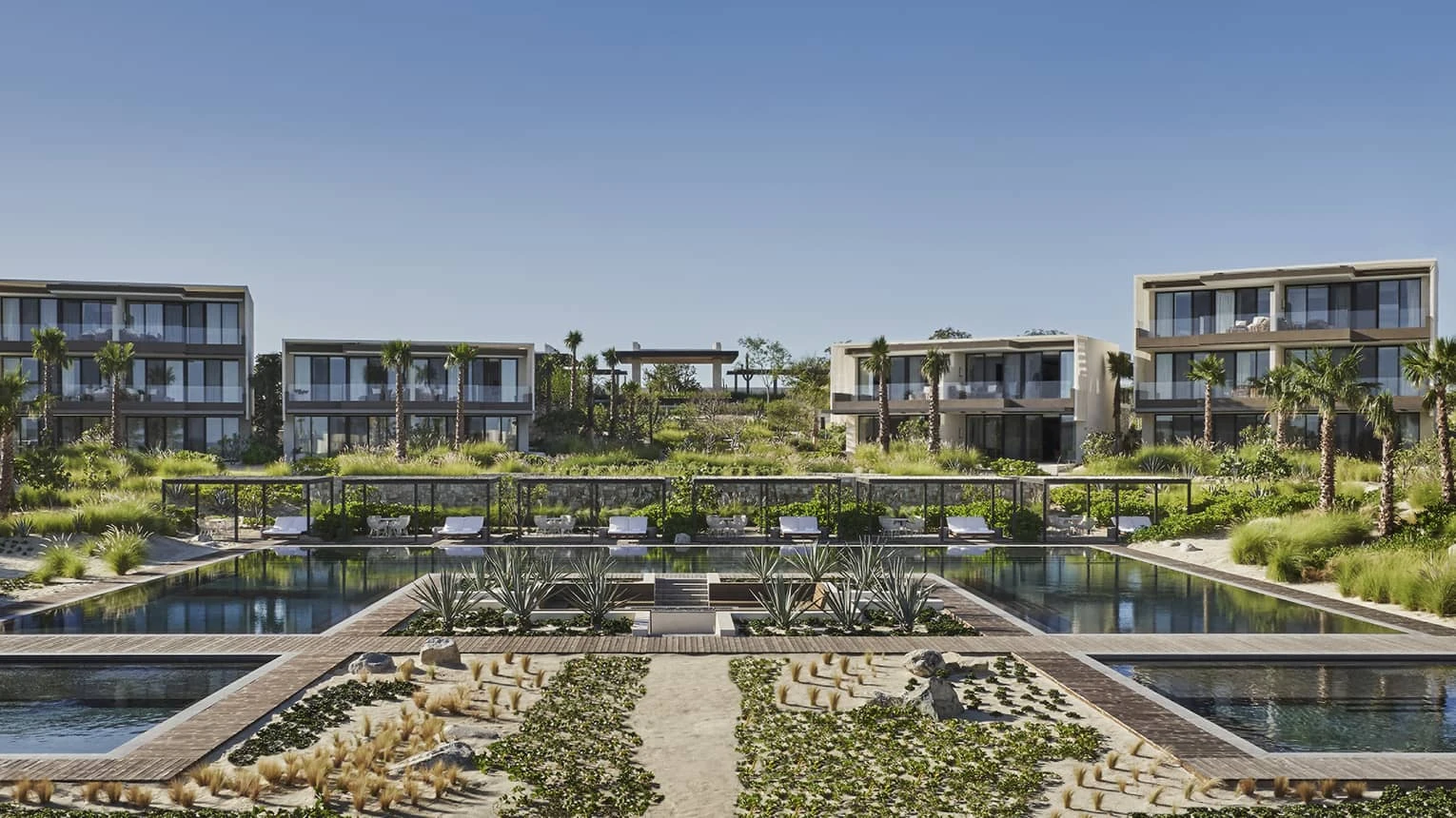 Outdoor pools and accommodation buildings at Four Seasons Resort Los Cabos at Costa Palmas